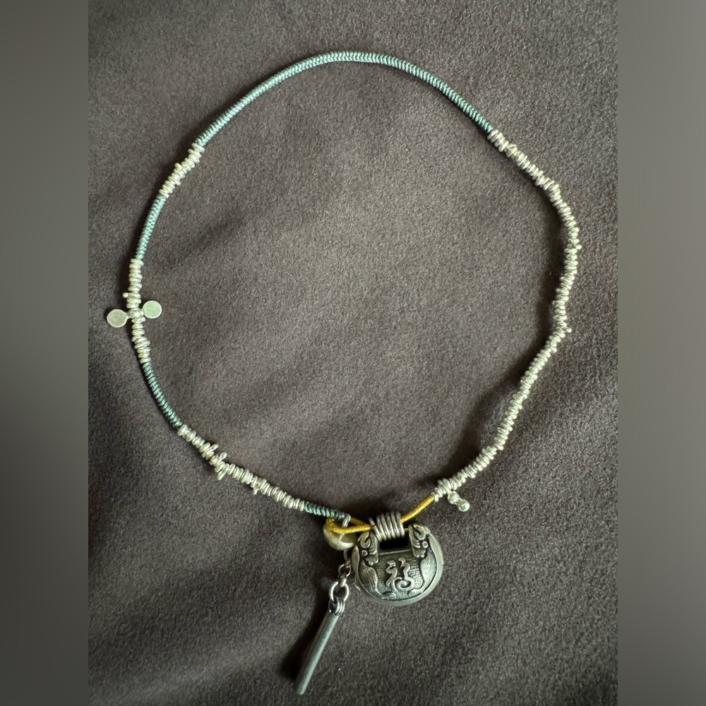 Unique hand-woven silver lock necklace
